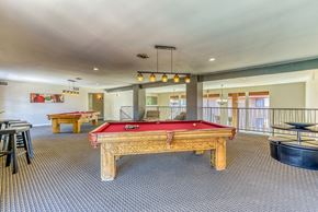 Upland apartment for rent - A room with a pool table and a billiard table.