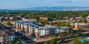 Longmont apartment for rent - A bird's eye view of a residential area with houses and apartment buildings.