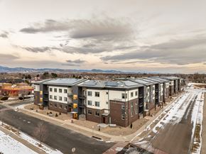 Longmont apartment for rent - Apartment complex with a road in front of it.