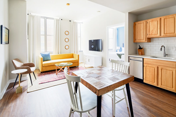Philadelphia apartment for rent - a living room and kitchen with a table and chairs