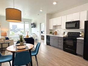 Columbus apartment for rent - A modern kitchen with a dining table set for two.