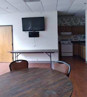 Springfield apartment for rent - an empty conference room with a tv on the wall