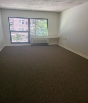 Springfield townhouse for rent - an empty room with a large window and a radiator