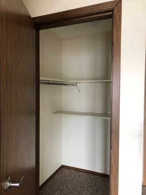 Cedar Rapids apartment for rent - A brown door with a silver handle is open.