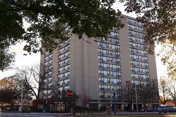 Oak Park apartment for rent - A tall building with a stop sign in front of it.