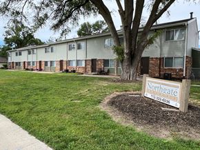 Council Bluffs apartment for rent - a neighborhood sign in front of an apartment building