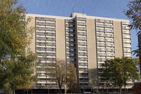 Springfield apartment for rent - a large apartment building with trees in front of it