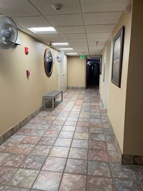 Taylorville apartment for rent - a hallway with a bench and a fan