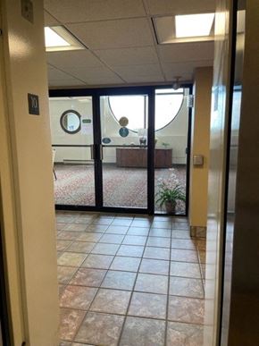 Taylorville apartment for rent - a hallway with an open door and tiled floor