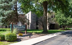 Springfield apartment for rent - A sign for Washington Plaza stands in front of a building.