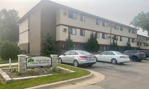 Marion apartment for rent - A building with a sign that says Oak Village Senior Residences.