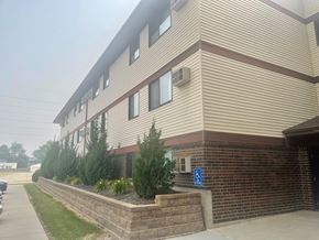 Marion apartment for rent - A building with a blue handicap sign on the wall.