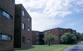 Centralia apartment for rent - A large brick building with a tree in front of it.