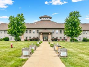 Savoy apartment for rent - the front of a large building with trees and a sidewalk