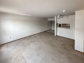Savoy apartment for rent - an empty living room with white walls and a concrete floor