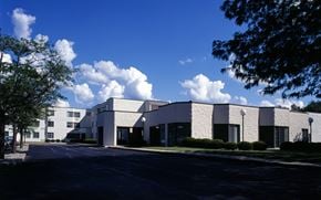 Danville apartment for rent - A white building with a parking lot in front.