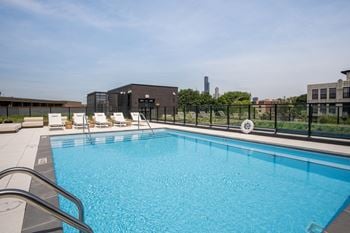Outdoor pool at the rosie, apartments in pilsen at 1461 s blue island ave.