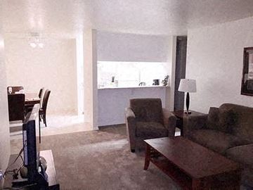 San Jose apartment for rent - a living room with a couch a chair and a table