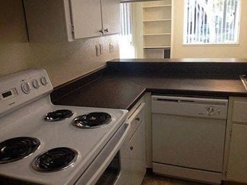 San Jose apartment for rent - a kitchen with a stove top oven and a sink