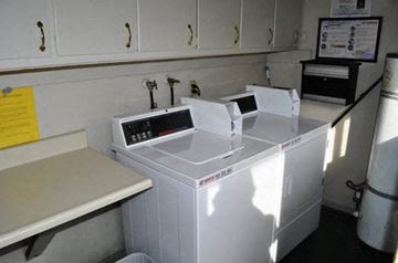 Santa Clara apartment for rent - three microwaves in a kitchen with white cabinets