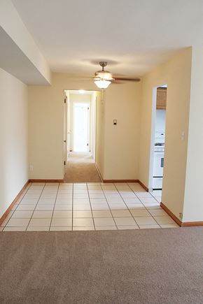 Cleveland Heights apartment for rent - an empty living room with tile floors and a ceiling fan