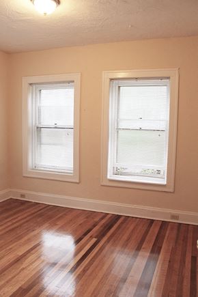 Cleveland Heights apartment for rent - a living room with two windows and a hard wood floor