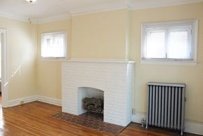 Cleveland Heights apartment for rent - a living room with a fireplace and a wooden floor
