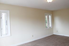 Cleveland Heights apartment for rent - A room with a carpeted floor and two windows.