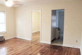 Cleveland Heights apartment for rent - A room with a wood floor and a ceiling fan.