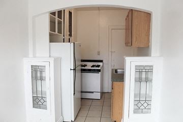 Cleveland Heights apartment for rent - a kitchen with a refrigerator and a stove in it