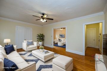 Cleveland Heights apartment for rent - A living room with a white couch and a blue rug.