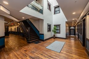 Cleveland apartment for rent - a large living room with a staircase and wood floors