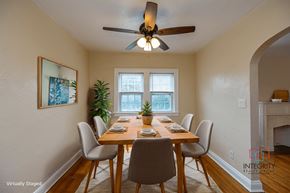 Cleveland Heights apartment for rent - A furnished dining room example with a wooden table and chairs.