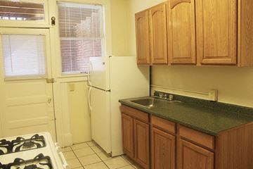 Cleveland Heights apartment for rent - a kitchen with a sink and a refrigerator