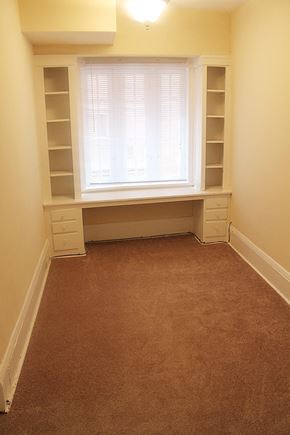 Cleveland Heights apartment for rent - a room with a window and white shelves and a carpet