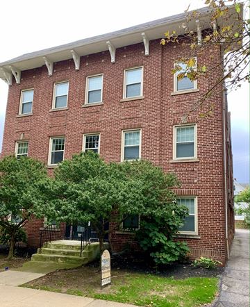 Cleveland Heights apartment for rent - a brick building with a tree in front of it