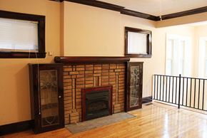 Cleveland Heights apartment for rent - a living room with a brick fireplace and a wooden floor