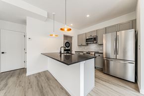 Westlake apartment for rent - A modern kitchen with stainless steel appliances and a central island at Westwood Meadows, Westlake, OH, 44145