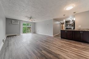 Berea apartment for rent - A spacious room with wood flooring and a ceiling fan. at Integrity Berea Apartments, Berea, Ohio