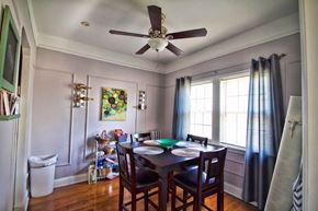 Cleveland apartment for rent - a dining room with a table and a ceiling fan