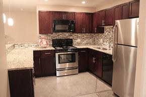 Cleveland Heights apartment for rent - a kitchen with stainless steel appliances and marble counter tops