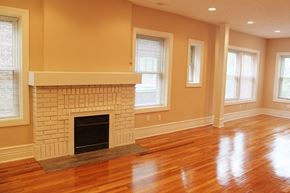 Cleveland Heights apartment for rent - a living room with a fireplace and a wooden floor