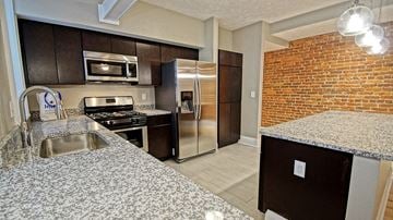 Cleveland Heights apartment for rent - a kitchen with stainless steel appliances and granite counter tops