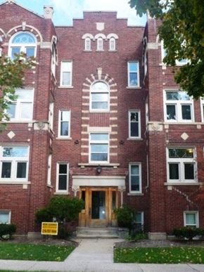 Cleveland Heights apartment for rent - the front of a brick building with a wooden door