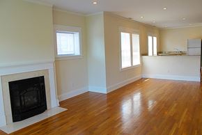 Cleveland Heights apartment for rent - an empty living room with a fireplace and a hard wood floor