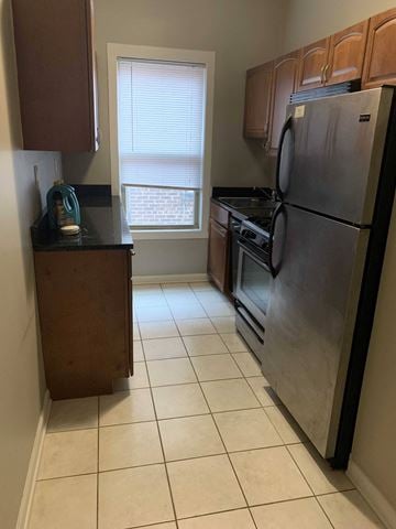 Cleveland Heights apartment for rent - a kitchen with stainless steel appliances and a window