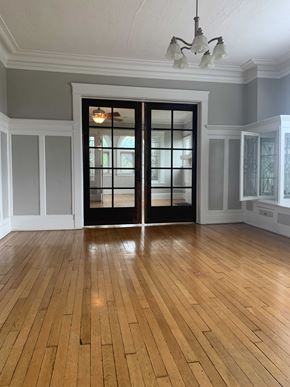 Cleveland Heights apartment for rent - an empty living room with a hard wood floor and glass doors