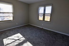 Cleveland Heights apartment for rent - an empty room with two windows and a carpeted floor