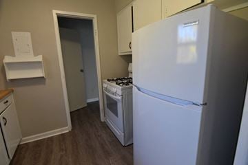 Cleveland Heights apartment for rent - a kitchen with a refrigerator and a stove