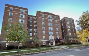 Cleveland apartment for rent - A large brick apartment building with multiple windows and balconies.